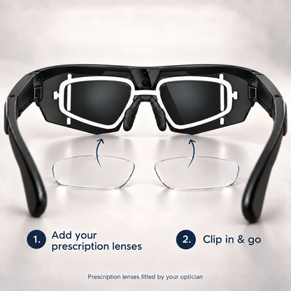 Black smart glasses with white trim and clear prescription lenses, shown with instructional arrows and text explaining how to clip in and go with your prescription lenses.